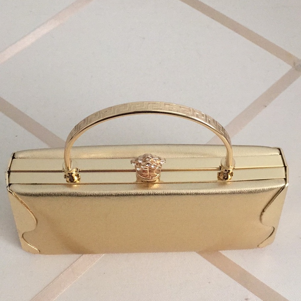Cute evening clutch in gold tone